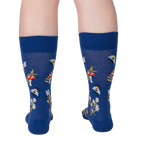 Rear view of 'Let it Bee' socks on a person's legs.  Shows the back of the sock design.
