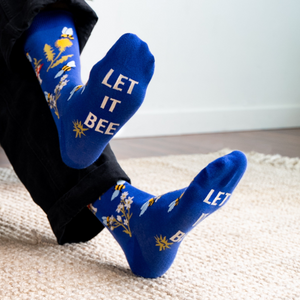 Close-up shot of the foot of the 'Let It Bee' sock with the phrase 'Let It Bee' visible.