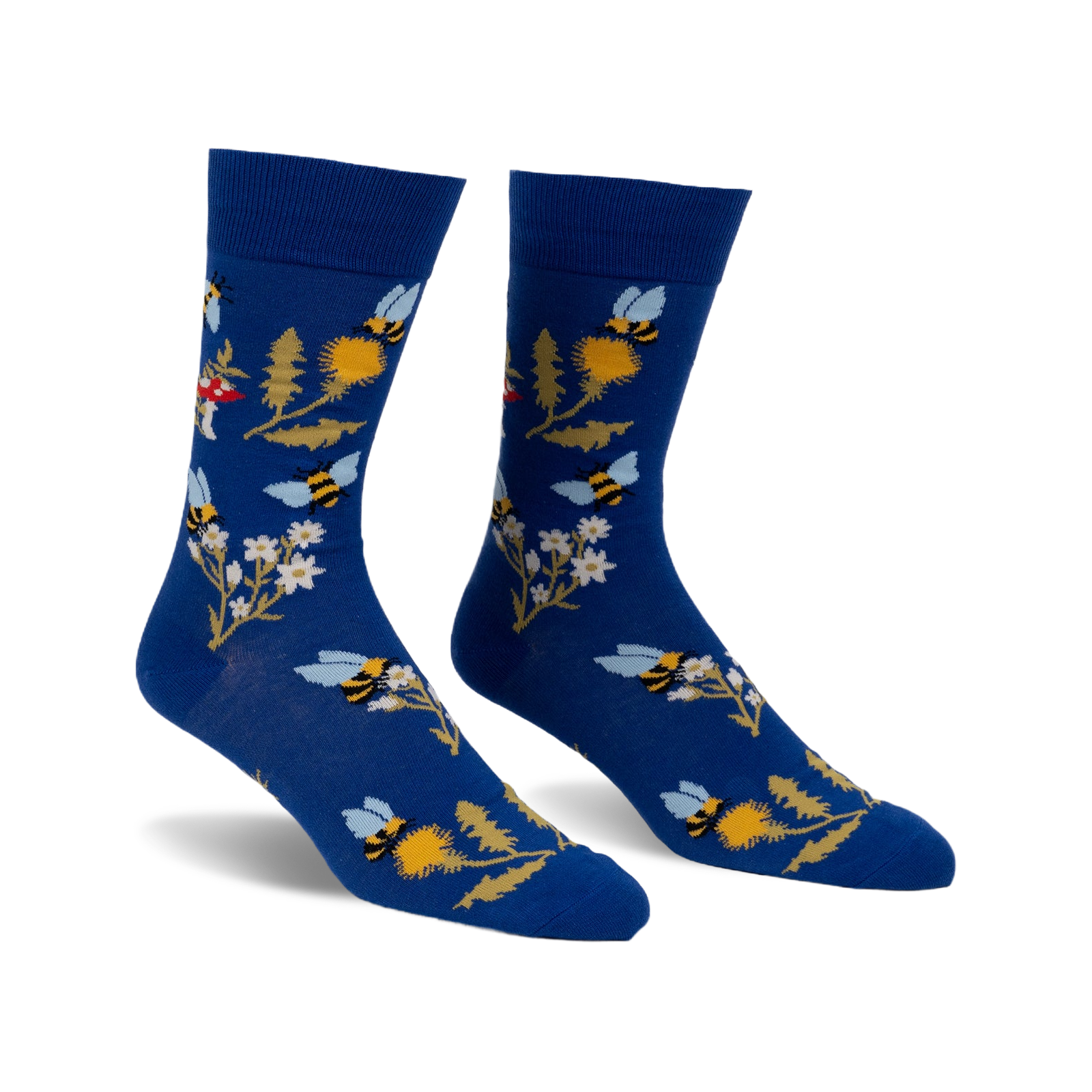 Pair of blue crew socks with whimsical bee, flower, and mushroom design.  Features yellow, white, and red accents.
