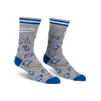 Gray crew socks with blue cuffs and a fun pattern of calculators, geometric shapes, and pencils. The word 'Mathlete' is written on the socks.
