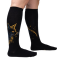 Lifestyle shot showing the Night Cat knee-high socks on a person's legs, showcasing the fit and design.