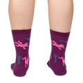 Back view of a person wearing Relaxolotl socks, showcasing the axolotl and fern pattern.