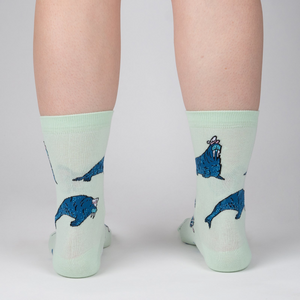 Lifestyle shot showing the socks on a person's legs from the back, showcasing the full design of the socks.