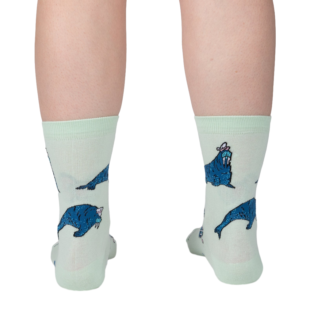 Lifestyle shot showing the socks on a person's legs from the back, showcasing the full design of the socks.