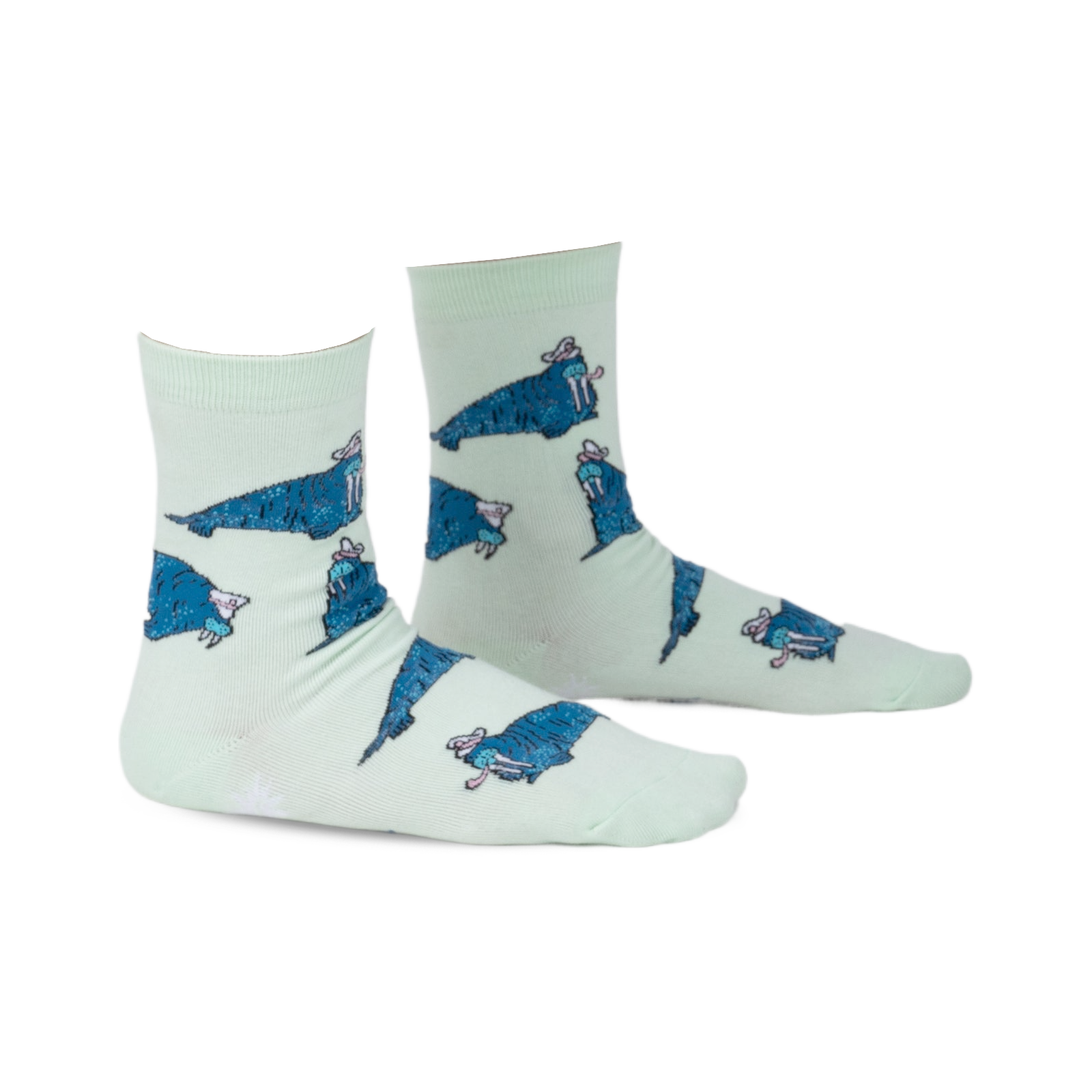 Pair of mint green crew socks featuring a repeating pattern of cartoon walruses wearing sombreros.  The socks have a playful design and blue walrus accents.