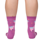 Lifestyle shot showing the 'When Pigs Fly' socks on a person's legs, showcasing the sock's fit and design.