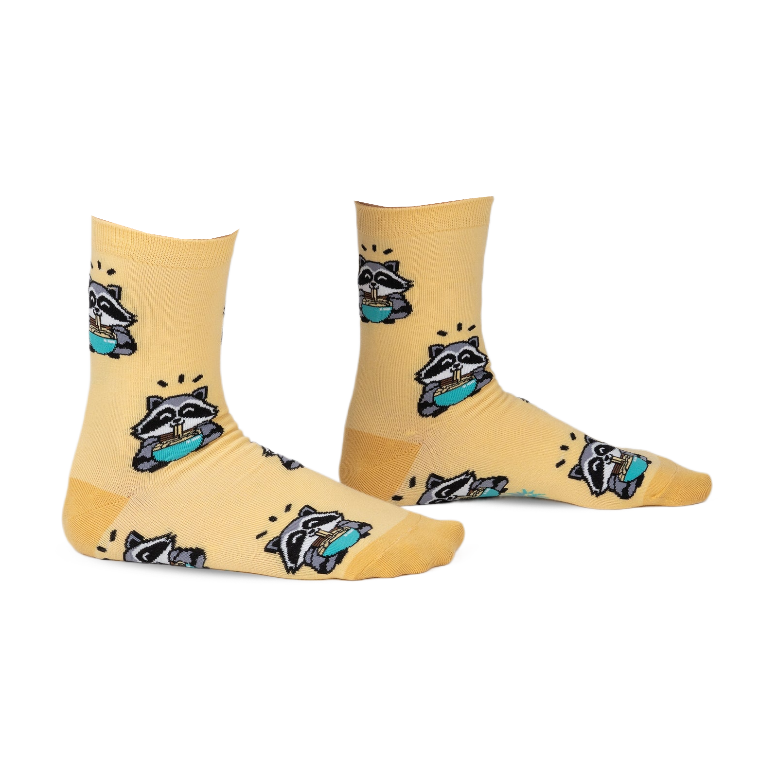 Pair of pastel yellow crew socks featuring a repeating pattern of raccoons enjoying ramen. 