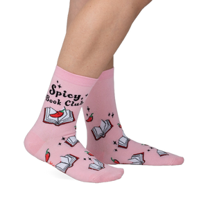 Pink crew socks with a playful design.  Features an illustration of books, chili peppers, and the text 