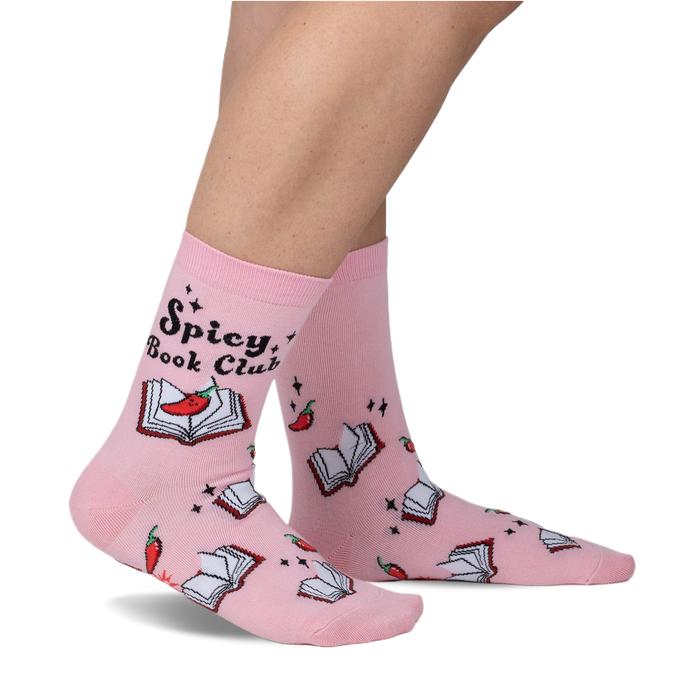 Pink crew socks with a playful design.  Features an illustration of books, chili peppers, and the text 