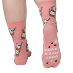 Close-up shot of the back of Cat-puccino socks. The socks have 'I DON'T GIVE A FRAPPE' text printed on the heel.