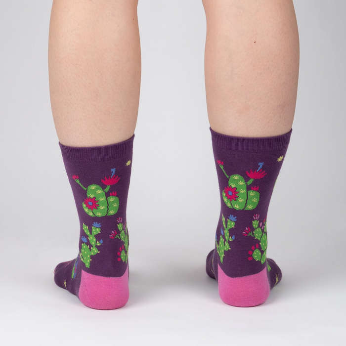 Lifestyle shot showing the socks on a person's legs, showcasing how they look when worn.