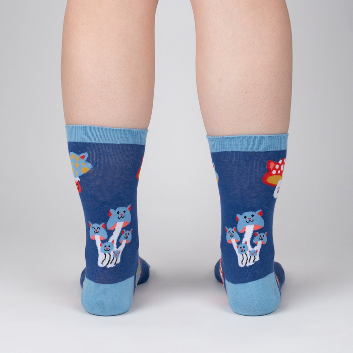 Back view of a person wearing a pair of Mushroom Cats socks, showcasing the design on the back of the socks.