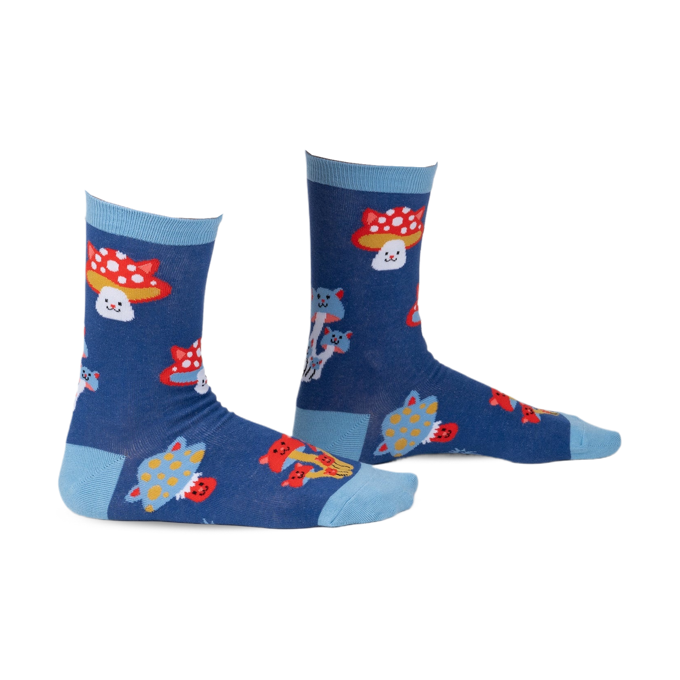 Pair of crew socks in navy blue with a whimsical design featuring cartoon cats and mushrooms in red, white, and yellow.