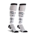 Pair of black and white knee-high socks.  The socks have a musical staff and notes design.