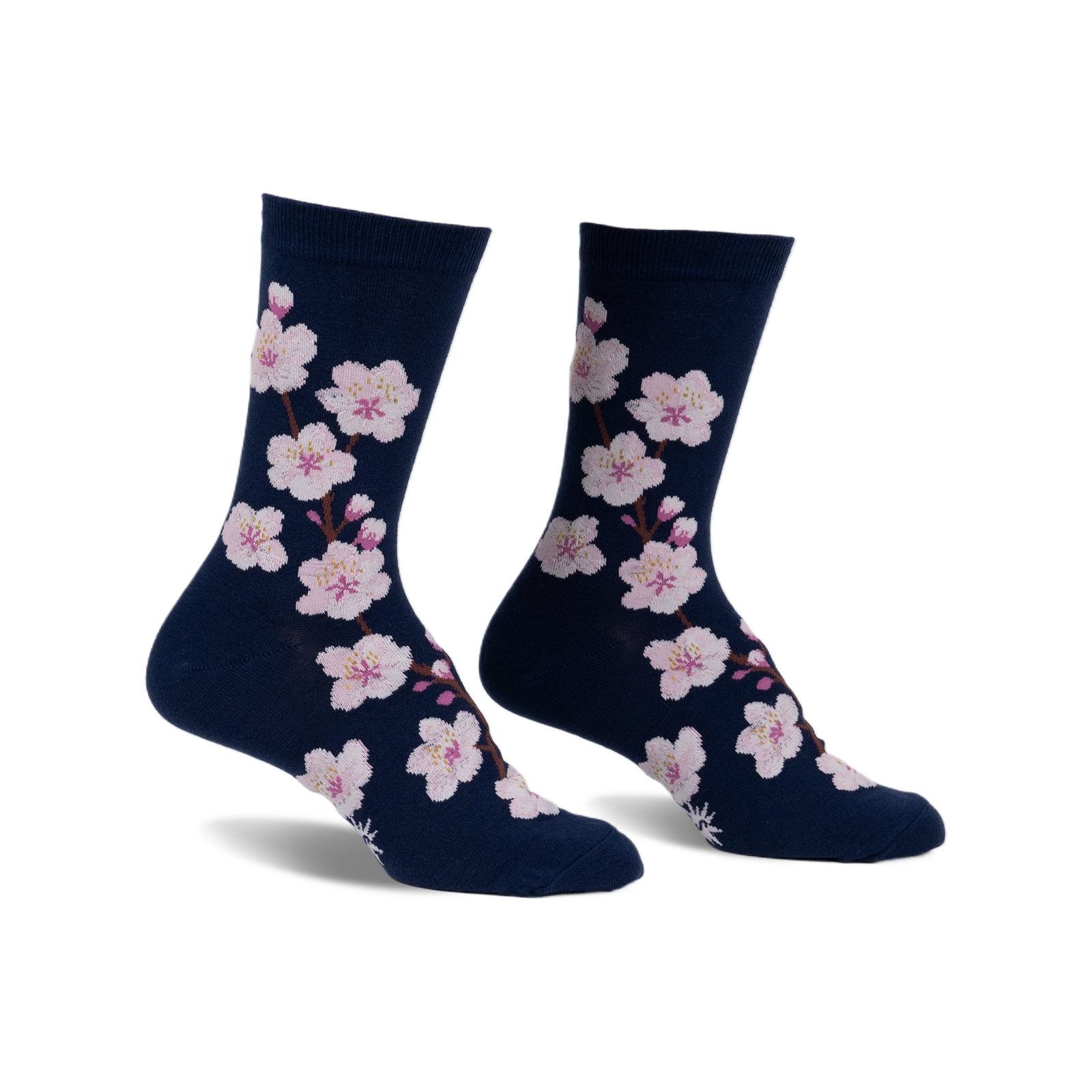 Pair of navy blue crew socks adorned with a pattern of pink cherry blossoms. 