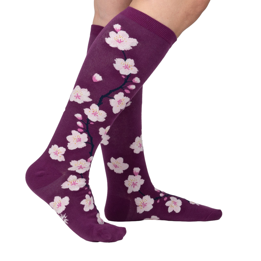 Lifestyle shot of Cherry Blossom socks on a woman's legs.
