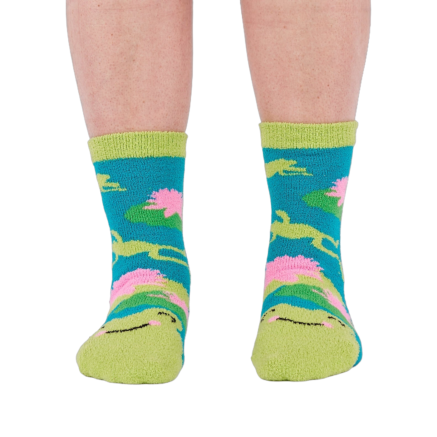 A person's legs and feet, viewed from the front, wearing the fuzzy teal blue slipper socks.