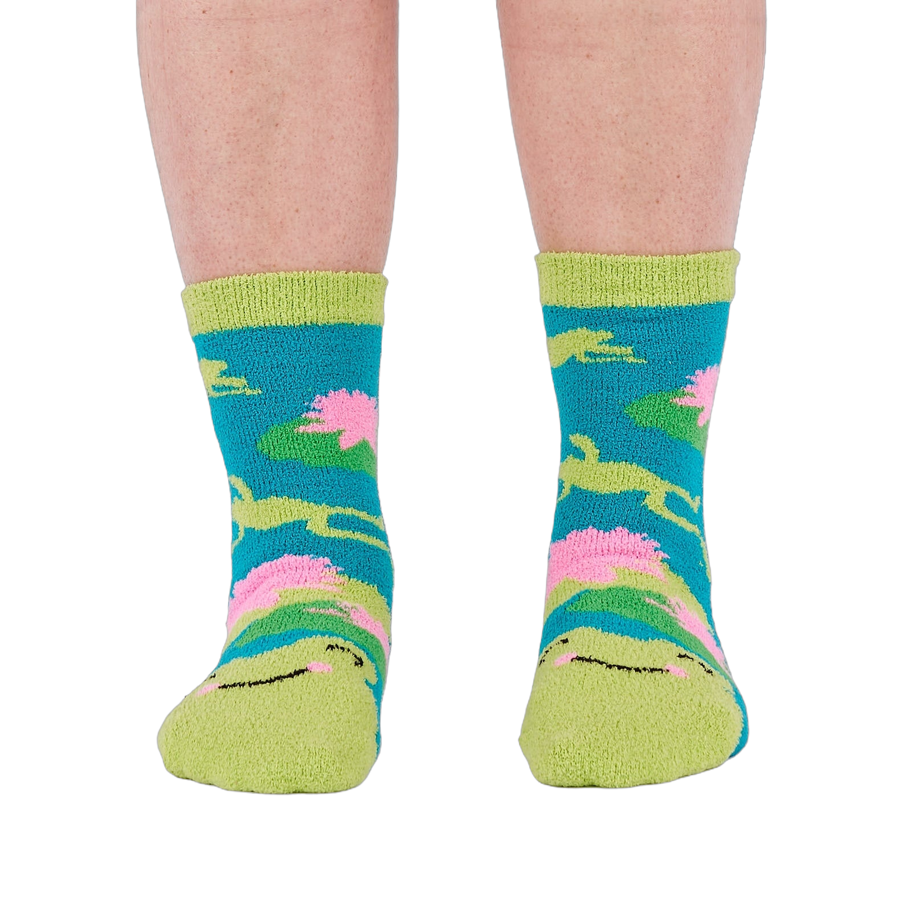 A person's legs and feet, viewed from the front, wearing the fuzzy teal blue slipper socks.