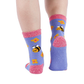 Person wearing fuzzy periwinkle slipper socks, back view, showing the anti-slip grippers on the sole.