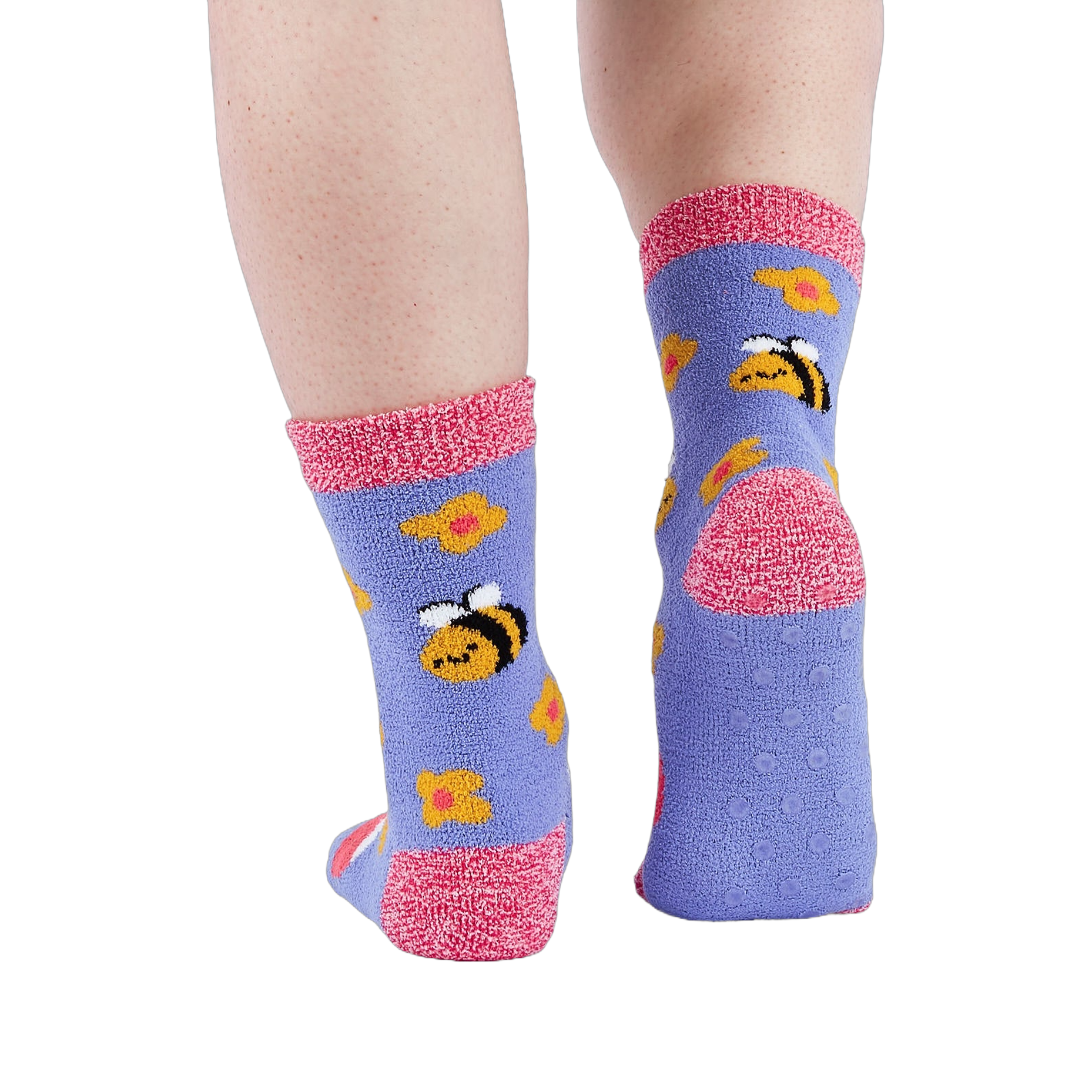 Person wearing fuzzy periwinkle slipper socks, back view, showing the anti-slip grippers on the sole.