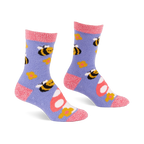 Pair of fuzzy periwinkle slipper socks with pink cuffs, heels, and toes, patterned with yellow bees, mushrooms, and flowers.