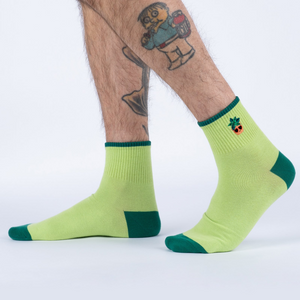 Lifestyle photo showing the Plant Lover socks on a person's feet.