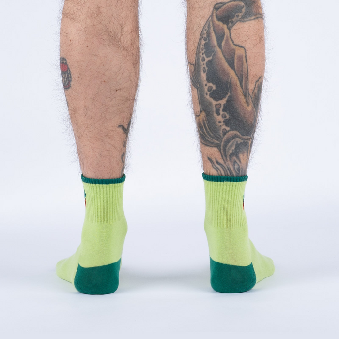 Back view of the Plant Lover socks on a person's legs.