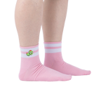 Lifestyle shot of person wearing pink ankle socks with olive embroidery and white stripes.