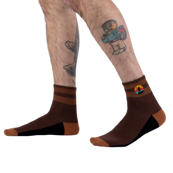 Lifestyle photo showing the socks on a model's legs.