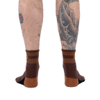 Rear view of the socks on a model's legs.