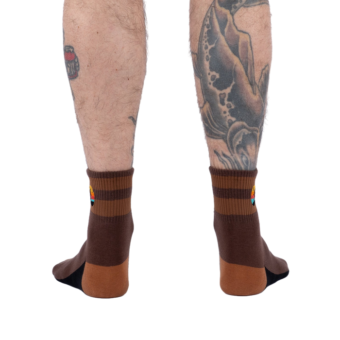 Rear view of the socks on a model's legs.