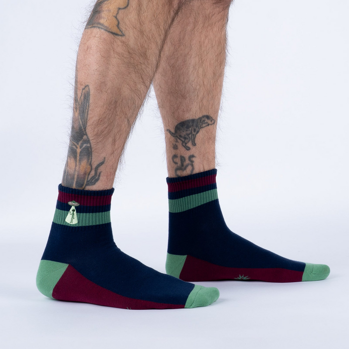 Lifestyle shot of a person wearing the 'I Believe' socks, showcasing the fit and style.
