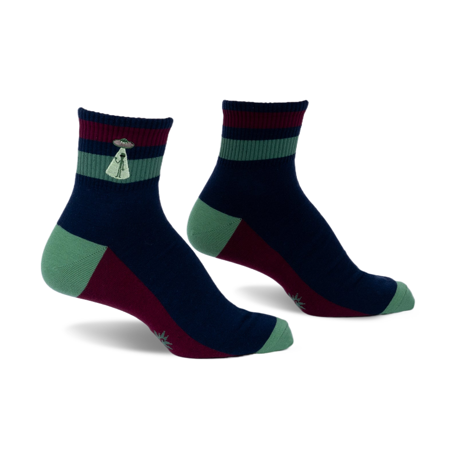 Pair of navy, burgundy, and green striped ankle socks. Features a small embroidered alien abduction scene on the cuff.