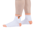 Lifestyle shot showing the socks on a person's feet against a white background.