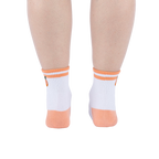 Rear view of the socks on a person's feet against a white background.