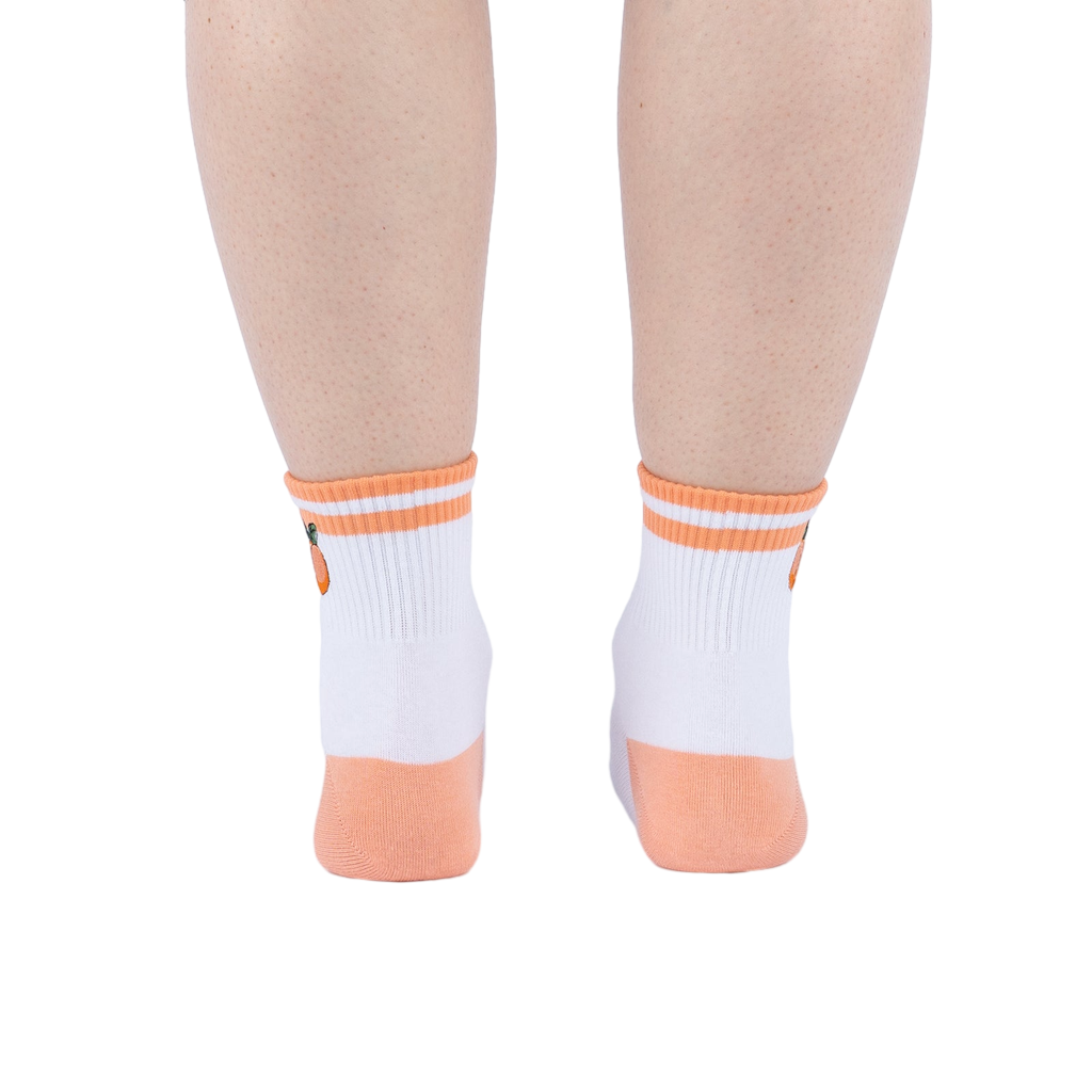 Rear view of the socks on a person's feet against a white background.