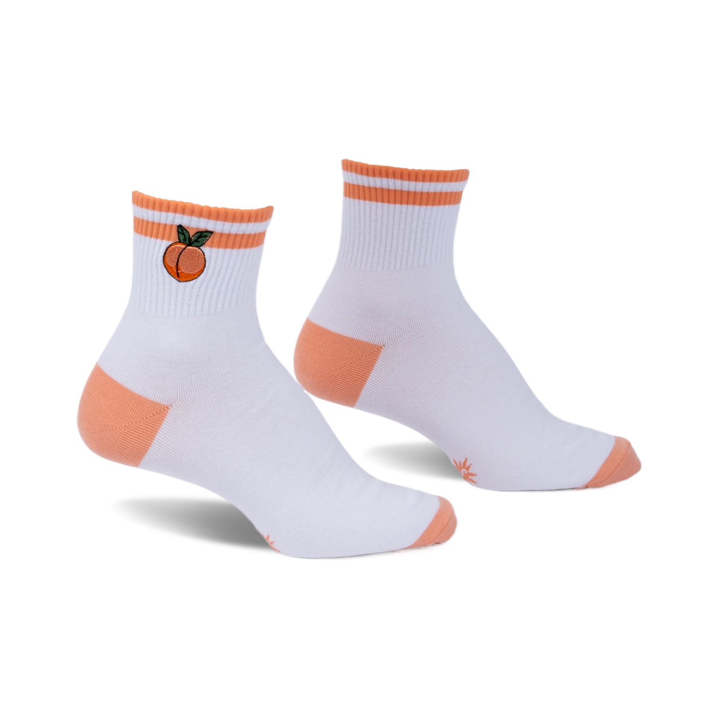 Pair of white ankle socks with peach embroidery, orange stripes, and orange heel and toe details. 