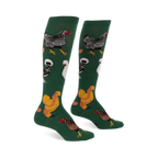 Pair of knee-high dark green socks featuring various types of chickens- mottled black, fluffy white, golden brown- with scattered eggs.