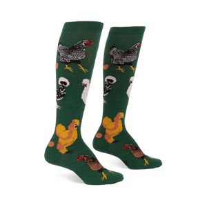 Pair of knee-high dark green socks featuring various types of chickens- mottled black, fluffy white, golden brown- with scattered eggs.