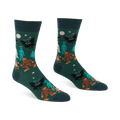 Pair of dark green crew socks with a repeating pattern of Bigfoot, Mothman, alien, Yeti, campfire, trees, moon, and stars.