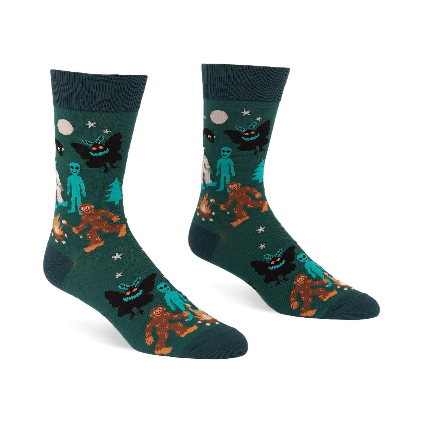 Pair of dark green crew socks with a repeating pattern of Bigfoot, Mothman, alien, Yeti, campfire, trees, moon, and stars.