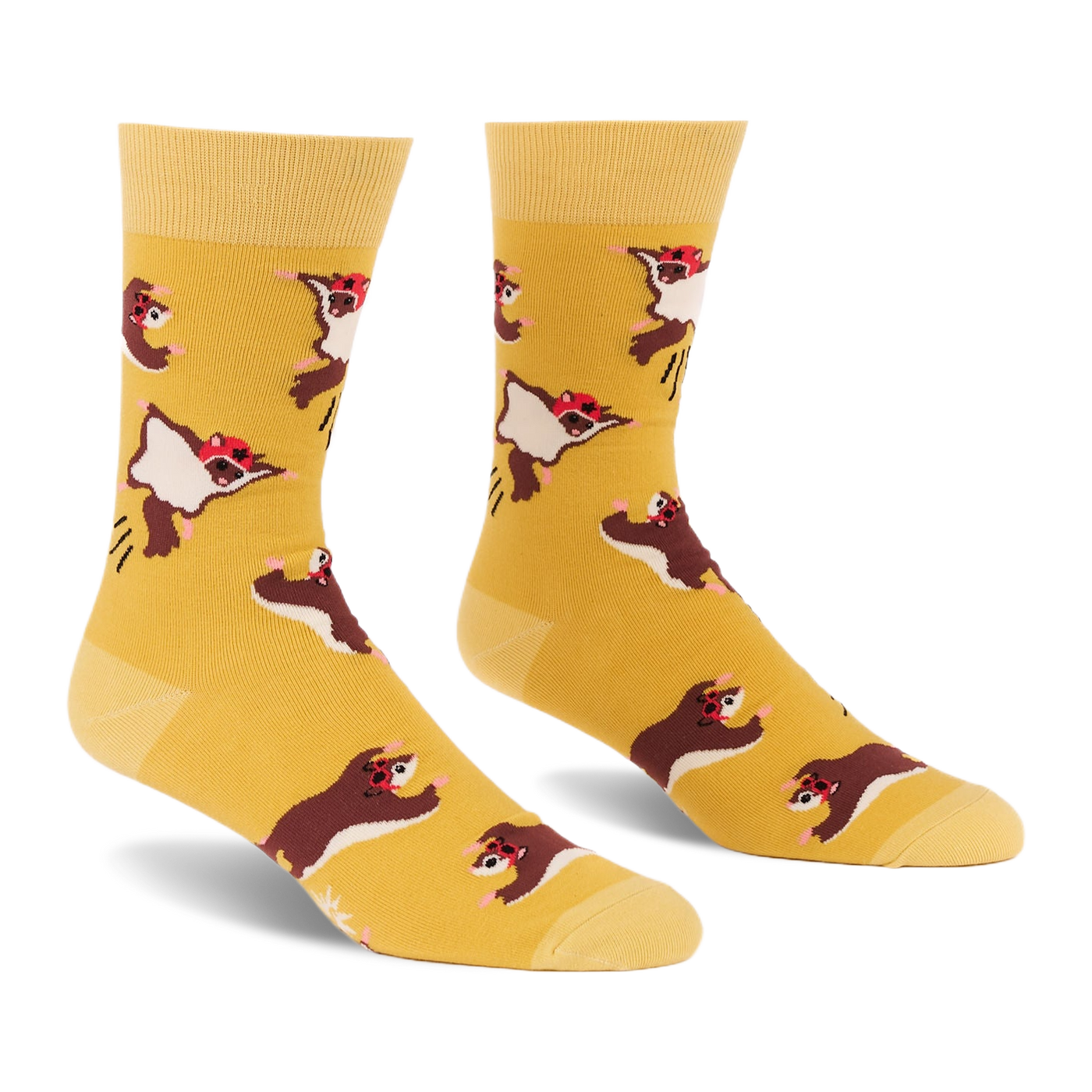 Pair of crew socks in mustard yellow with an all-over pattern of brown and white flying squirrels wearing red caps, shown against a white background.