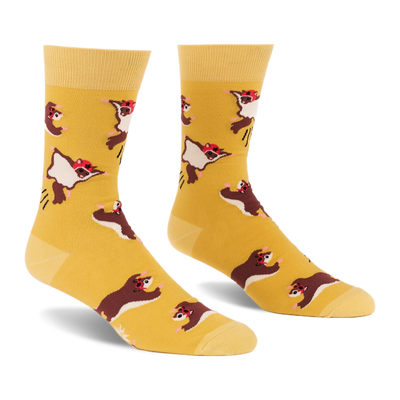 Pair of crew socks in mustard yellow with an all-over pattern of brown and white flying squirrels wearing red caps, shown against a white background.
