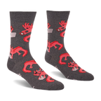 Pair of grey crew socks with a repeating pattern of coral pink axolotls holding game controllers and smartphones.