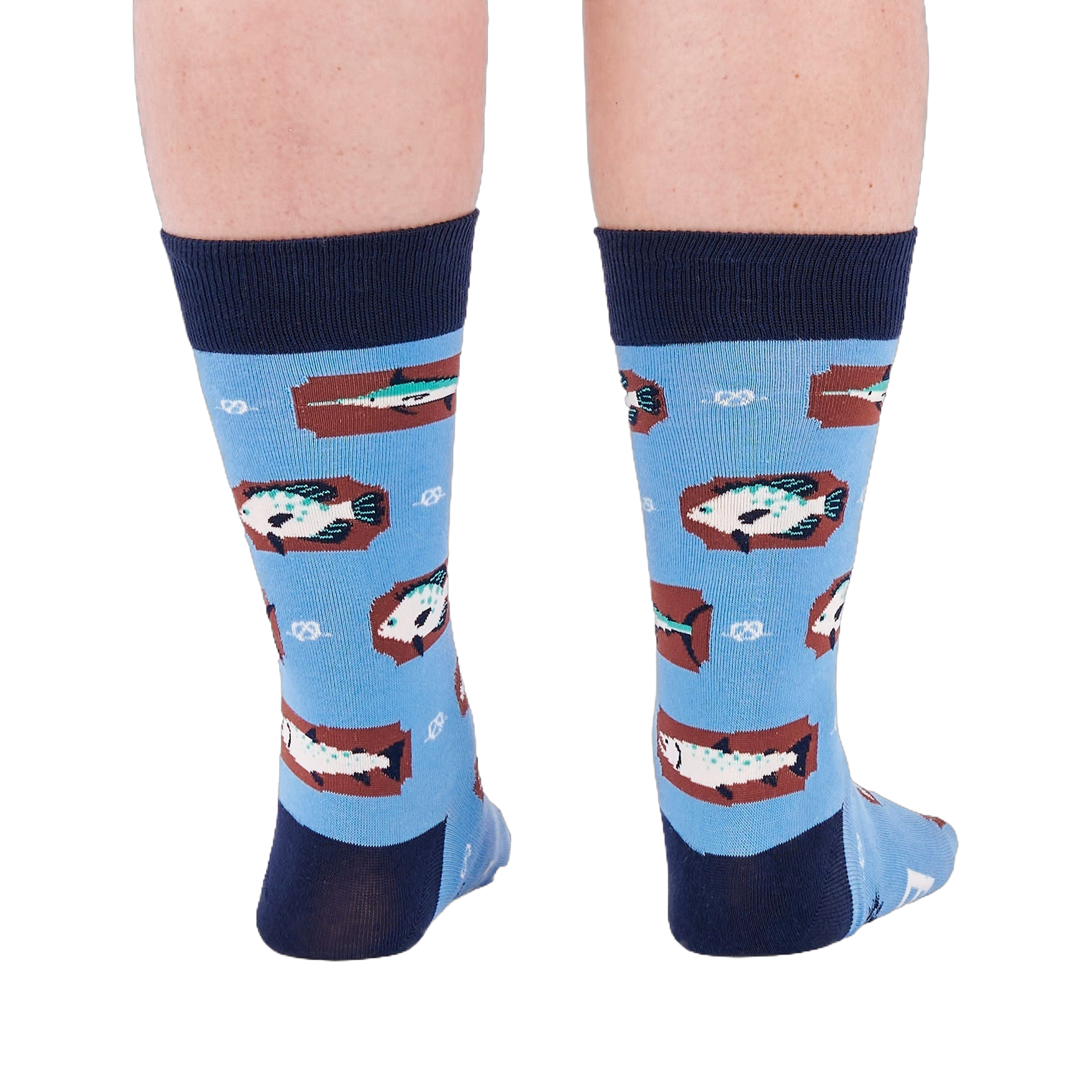 Person standing backward, showing the heels of light blue crew socks with fish and knot patterns on a white background.