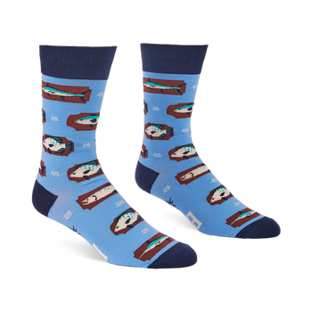 Pair of light blue crew socks with a repeating pattern of fish on brown rectangular shapes and white knot designs.