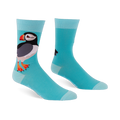 Light blue crew socks featuring a large puffin with a black back, white belly, and orange beak, with lighter blue cuffs.