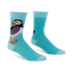 Light blue crew socks featuring a large puffin with a black back, white belly, and orange beak, with lighter blue cuffs.