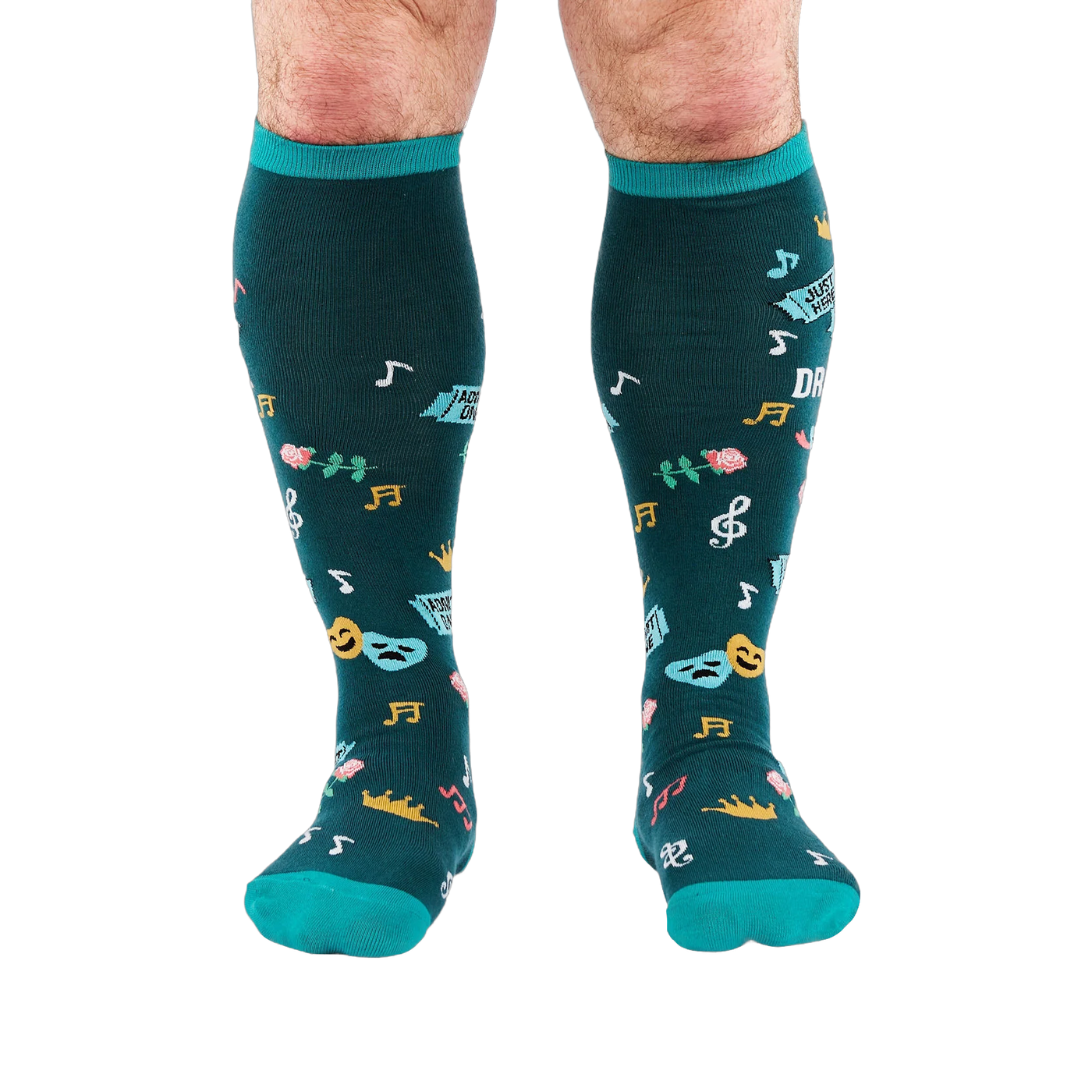 Front view of legs wearing dark teal knee-high socks with turquoise cuffs, showing scattered masks, roses, and musical notes.
