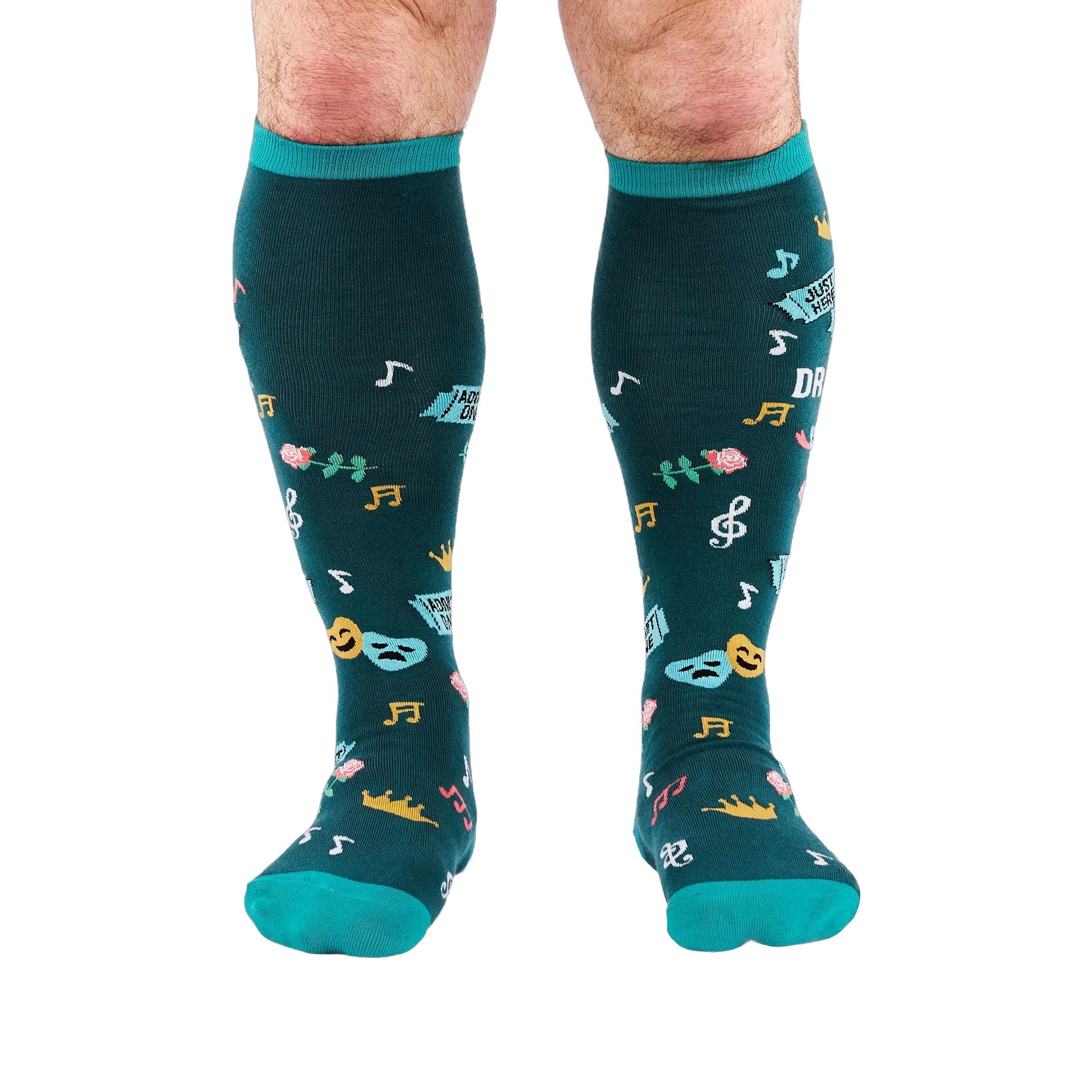 Front view of legs wearing dark teal knee-high socks with turquoise cuffs, showing scattered masks, roses, and musical notes.